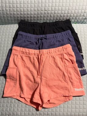Reebok Shorts Trio in Coral, Blue, and Black. Size - L